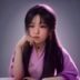 韩国影视专栏作者金雅静的职业照，女性，温和微笑，背景为简洁白墙